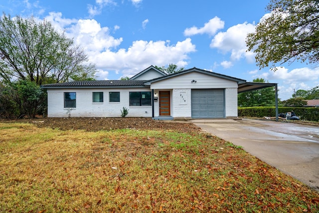 single story home with a carport, a garage, and a front yard