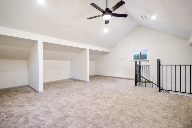 additional living space featuring light carpet, ceiling fan, and lofted ceiling