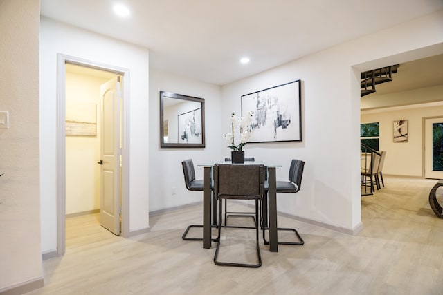 dining area featuring light wood-type flooring