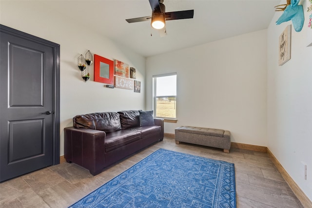 living room featuring wood-type flooring and ceiling fan