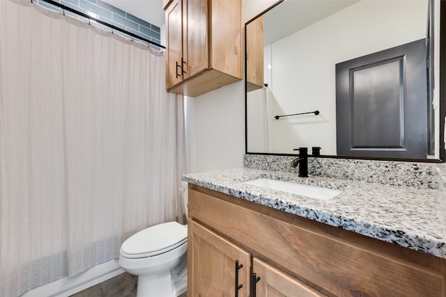 full bathroom featuring toilet, vanity, shower / bath combination with curtain, and tile patterned floors