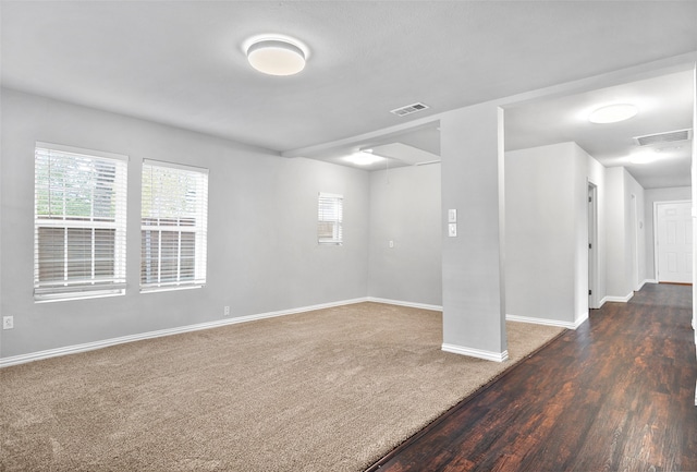 empty room featuring dark wood-type flooring