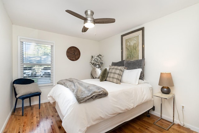 bedroom with wood-type flooring and ceiling fan