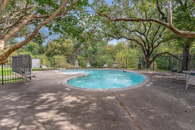 view of swimming pool featuring a patio