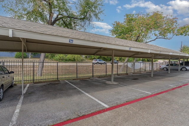 view of vehicle parking with a carport