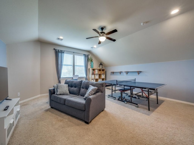 carpeted living room with vaulted ceiling and ceiling fan