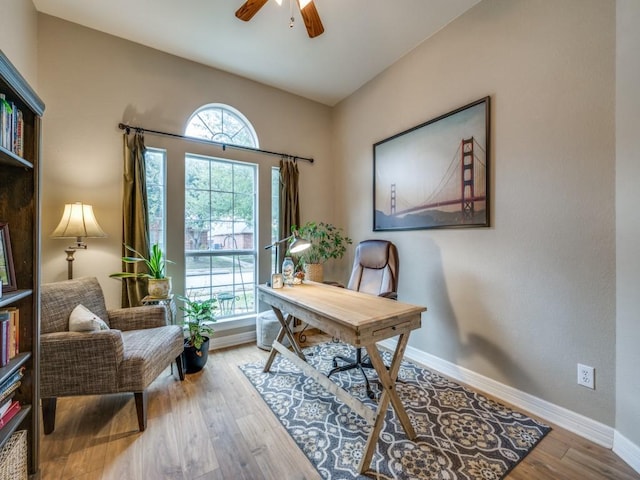 office with ceiling fan and wood-type flooring