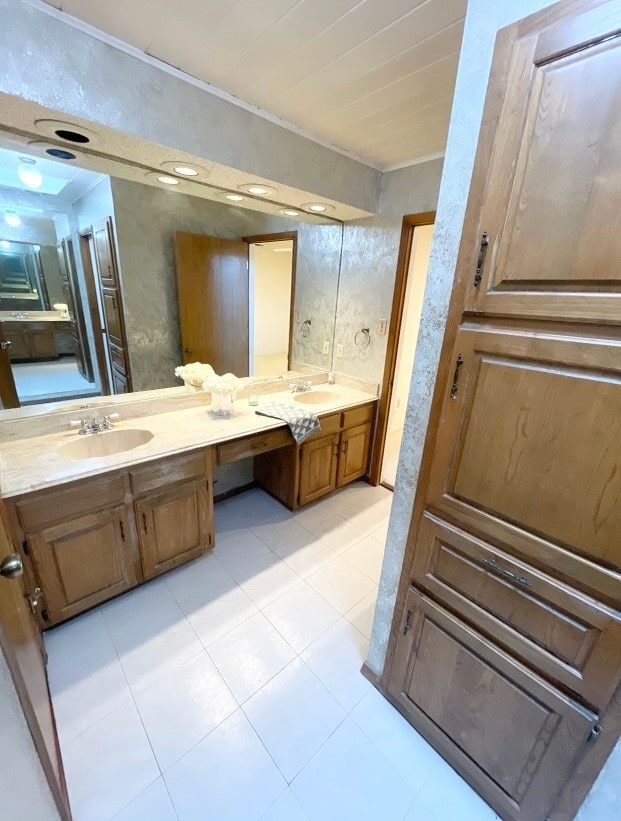 bathroom with vanity and tile patterned flooring