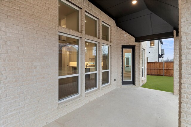 interior space with sink and vaulted ceiling