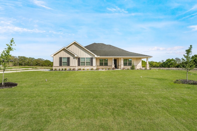 view of front of home with a front lawn and board and batten siding