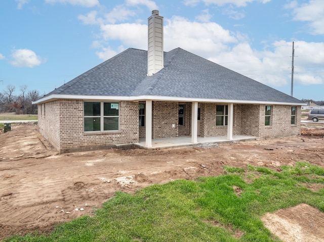 rear view of house featuring a patio area