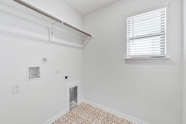 clothes washing area with baseboards, washer hookup, hookup for a gas dryer, electric dryer hookup, and laundry area