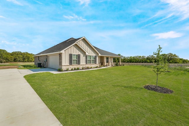 modern farmhouse style home featuring board and batten siding, a garage, a front yard, and concrete driveway