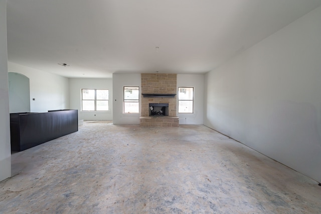 unfurnished living room featuring a fireplace