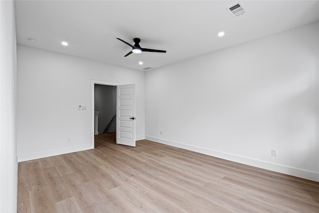 spare room with light hardwood / wood-style floors and ceiling fan