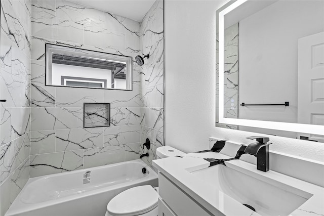 full bathroom featuring toilet, vanity, and tiled shower / bath