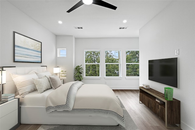 bedroom featuring light wood-type flooring and ceiling fan