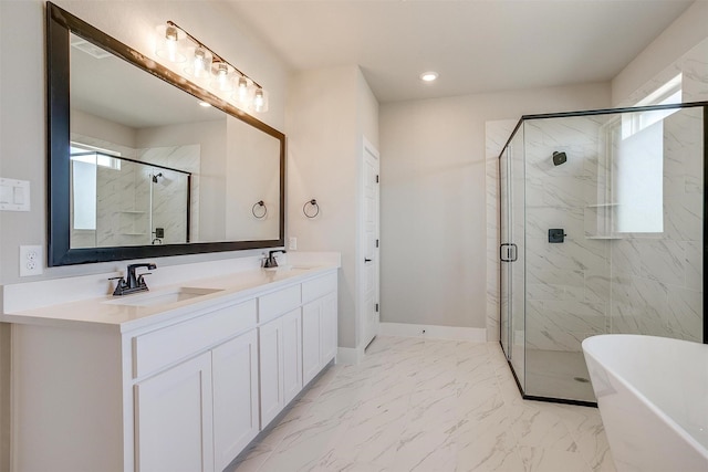 bathroom with plenty of natural light, separate shower and tub, and vanity