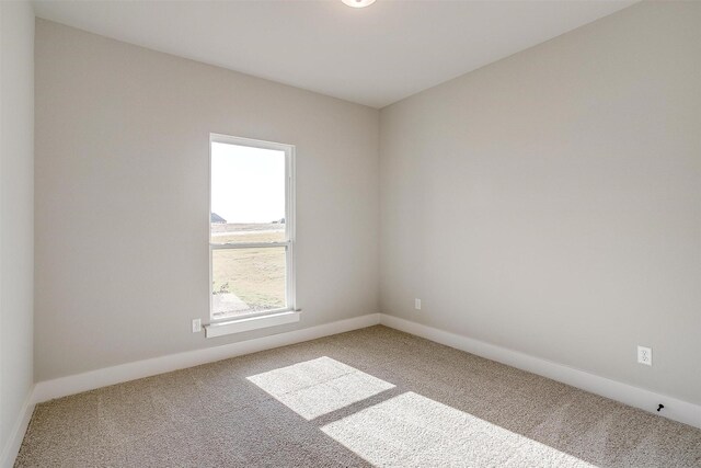 unfurnished room with carpet floors