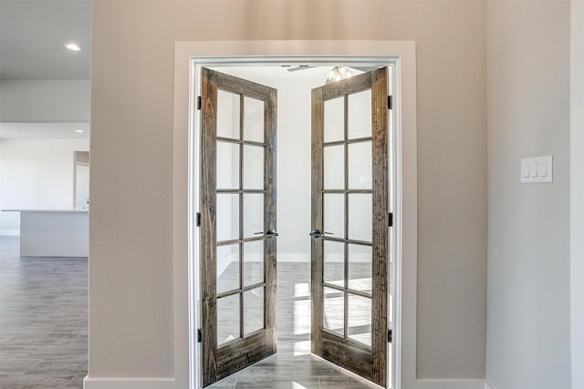 doorway featuring french doors and hardwood / wood-style flooring