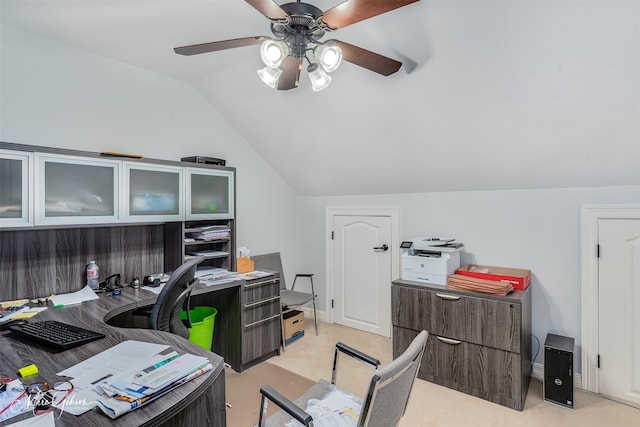 carpeted office space featuring ceiling fan and lofted ceiling