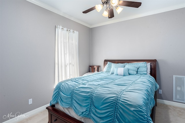 carpeted bedroom featuring ornamental molding and ceiling fan