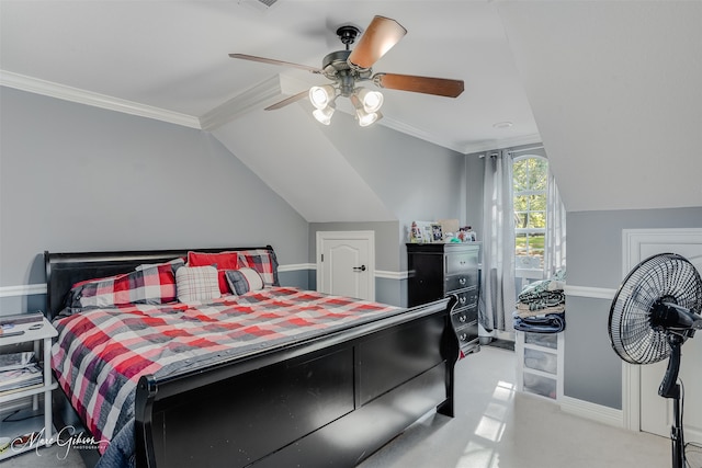 carpeted bedroom with vaulted ceiling, ceiling fan, and crown molding