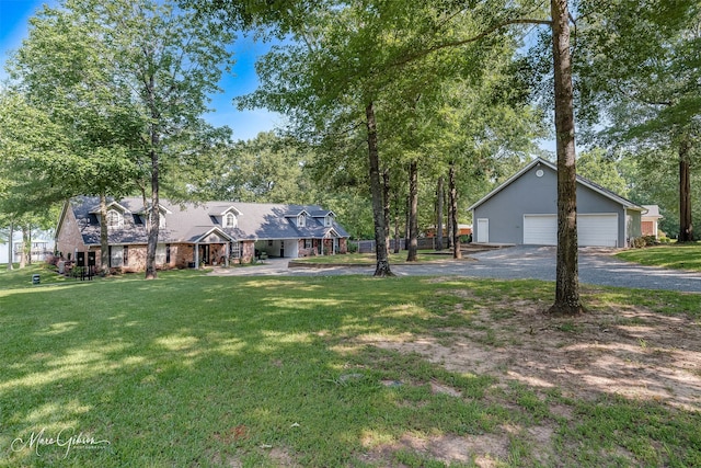 view of front of home featuring a garage and a front lawn