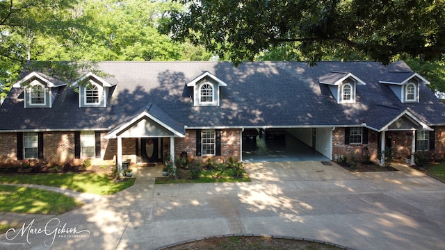 cape cod-style house with a carport