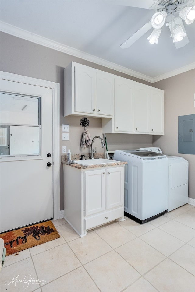 laundry room with electric panel, cabinets, sink, crown molding, and washing machine and dryer