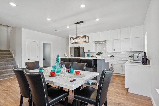 dining space featuring light hardwood / wood-style floors