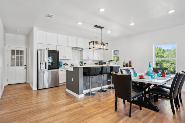 dining room with light hardwood / wood-style floors