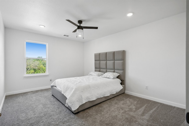 bedroom with ceiling fan and carpet flooring