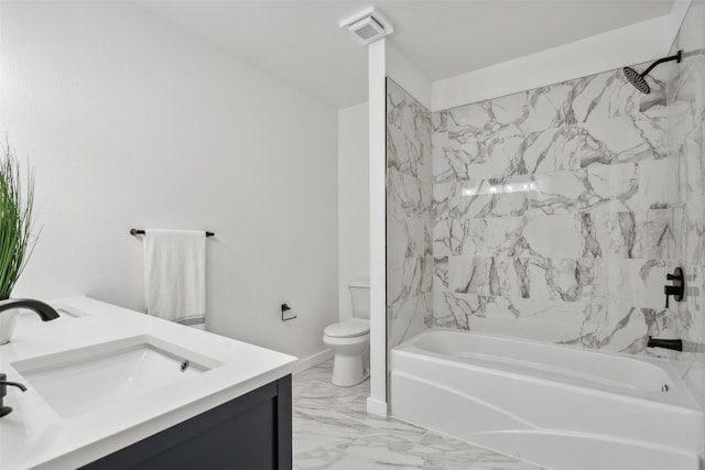 full bathroom featuring toilet, vanity, and tiled shower / bath