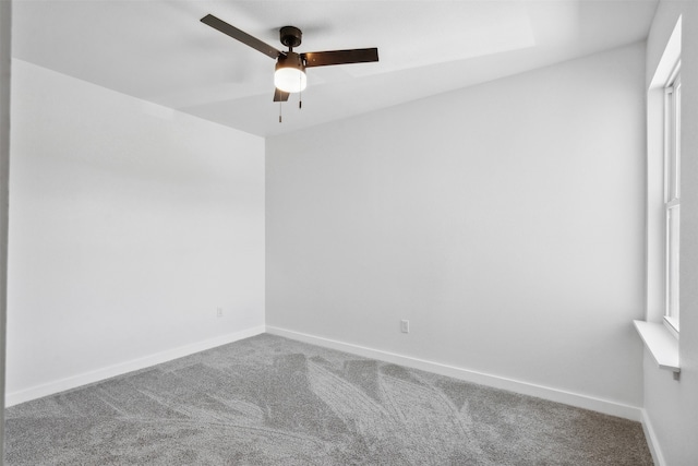 empty room featuring ceiling fan and carpet flooring