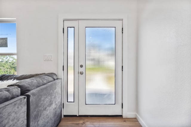 doorway to outside with hardwood / wood-style flooring