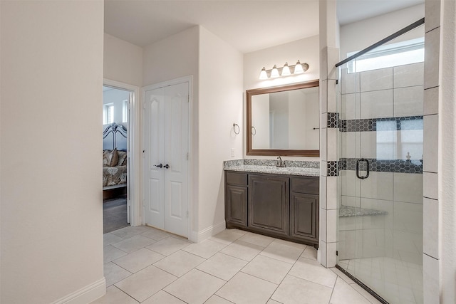 bathroom with vanity, tile patterned floors, and an enclosed shower