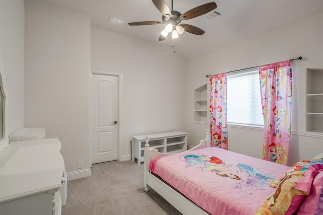 carpeted bedroom with vaulted ceiling and ceiling fan