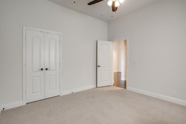 unfurnished bedroom featuring carpet flooring, visible vents, and baseboards