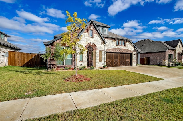 view of front facade with a front yard and a garage