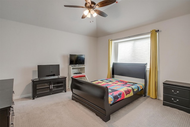 carpeted bedroom featuring vaulted ceiling and ceiling fan