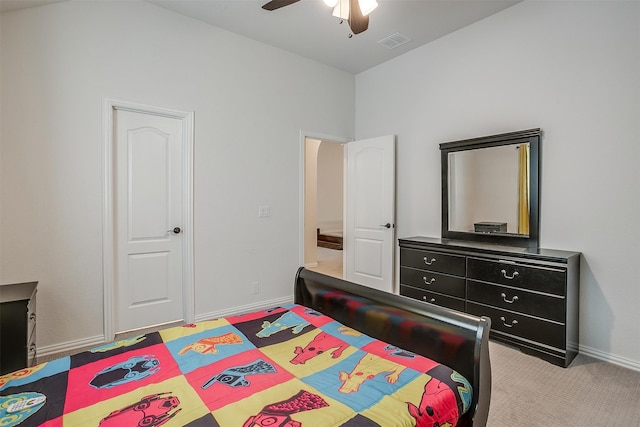 bedroom with ceiling fan and light colored carpet