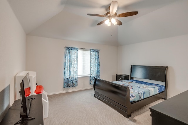 bedroom featuring light colored carpet, vaulted ceiling, and ceiling fan