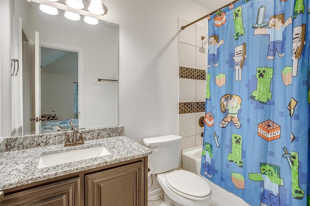 full bathroom featuring shower / tub combo with curtain, vanity, and toilet