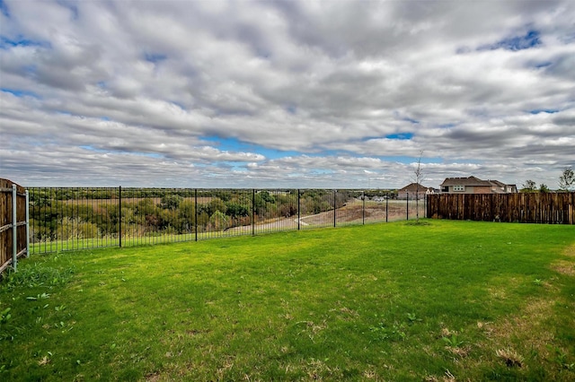 view of yard featuring fence