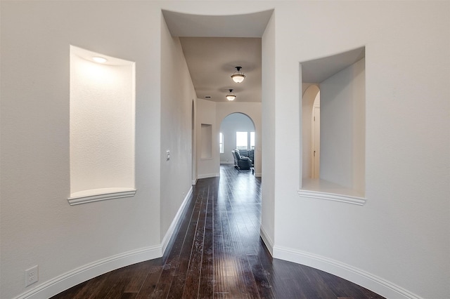 hallway with dark wood-type flooring