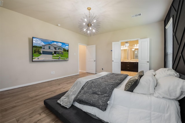 317 St Paul Ct, Heath, TX 75126 - bedroom featuring a chandelier, light wood finished floors, baseboards, and ensuite bathroom