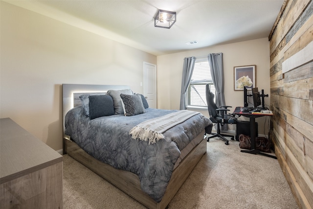 bedroom featuring light colored carpet