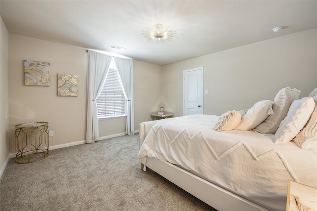 bedroom featuring light carpet