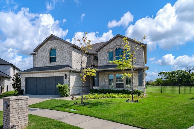 french country style house featuring a garage and a front yard